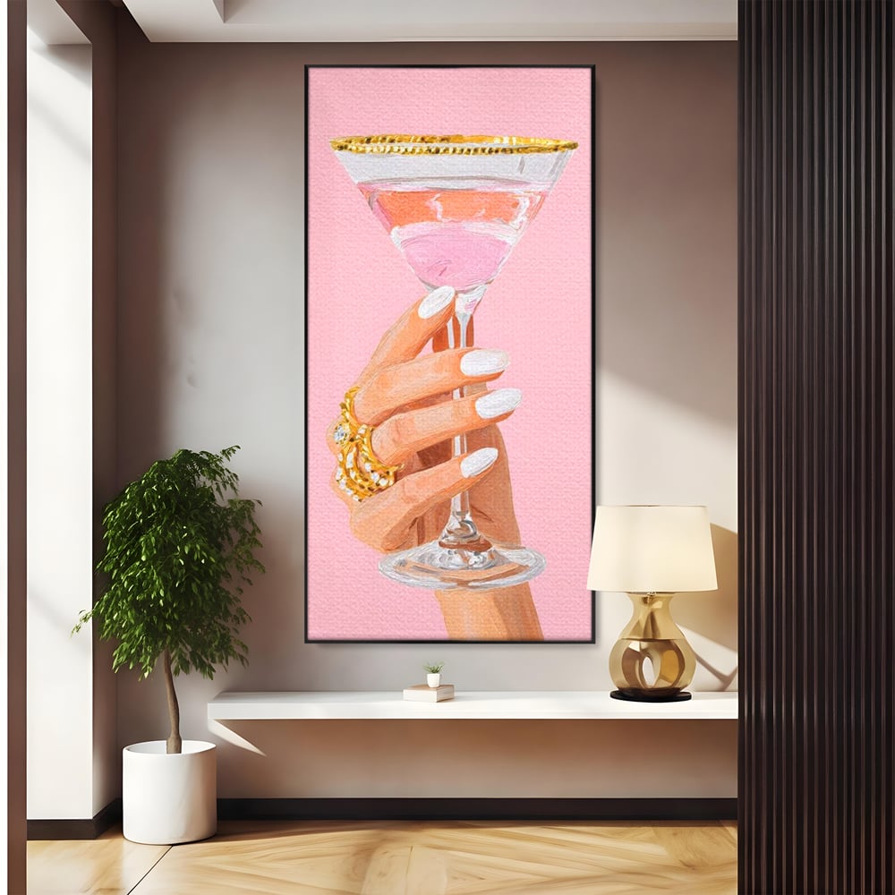 Tablou canvas cu ilustratie cu mana care tine pahar de cocktail, in rama de aluminiu negru